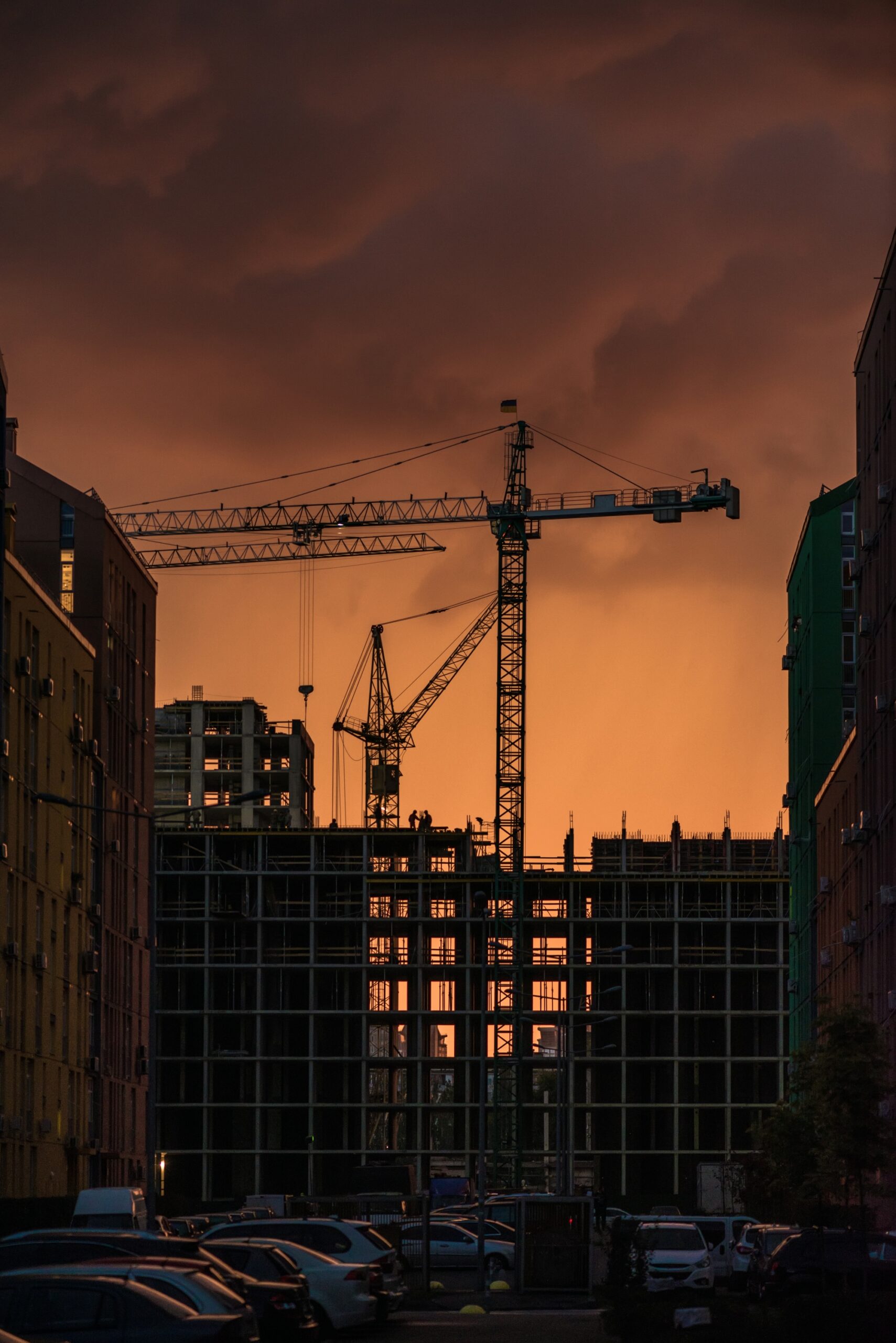 industrial construction crane building silhouettes sun sunset